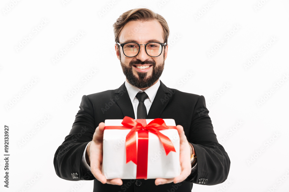 Handsome businessman gives you a gift present box. Handsome businessman gives you a gift present box.