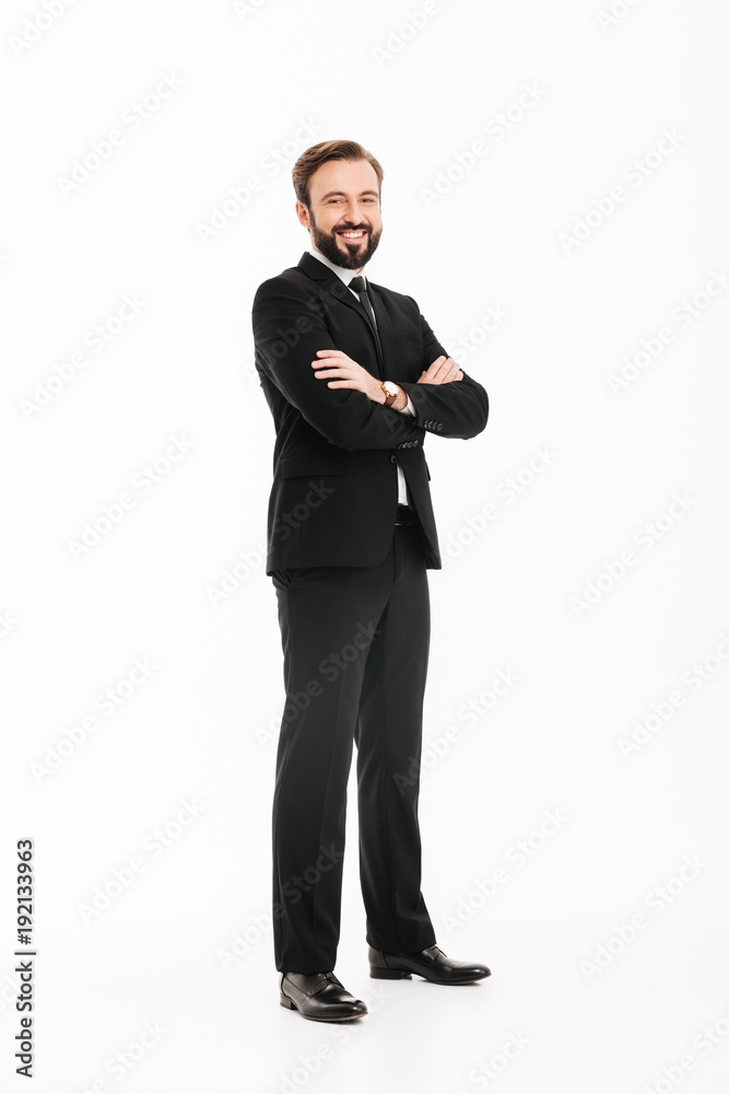 Cheerful young businessman with arms crossed. Cheerful young businessman with arms crossed.
