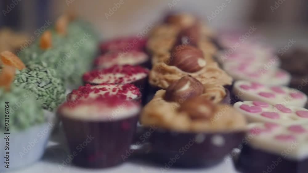 Rows of various sweets in the store, with a blur in the background. HD ...