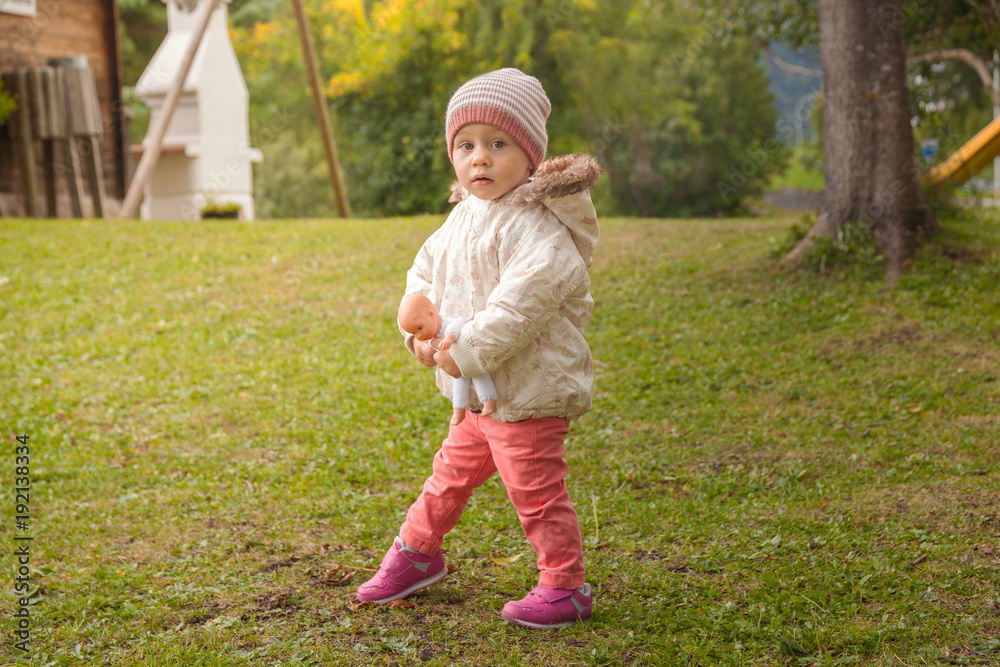 Small child girl playing outdoors Small child girl playing outdoors