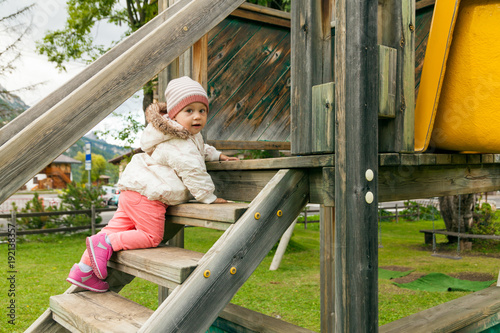Fototapeta Naklejka Na Ścianę i Meble -  Small child girl playing outdoors