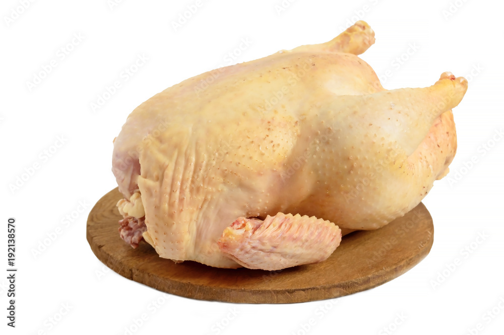 Large raw chicken (broiler) on a wooden stand, isolated on white background. Large raw chicken (broiler) on a wooden stand, isolated on white background.