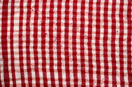 Background texture, pattern. Scarf wool like Yasser Arafat. The Palestinian keffiyeh is a gender-neutral checkered red and white scarf that is usually worn around the neck or head. photo