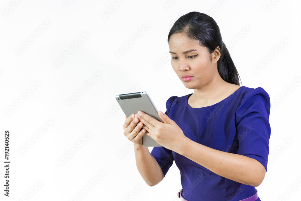 Asian business woman using tablet and blue suit ,isolated on white background Asian business woman using tablet and blue suit ,isolated on white background