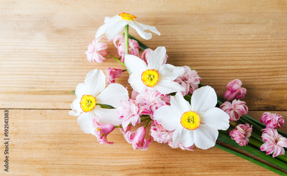 Colorful spring flowers bouquet on a wooden table Colorful spring flowers bouquet on a wooden table