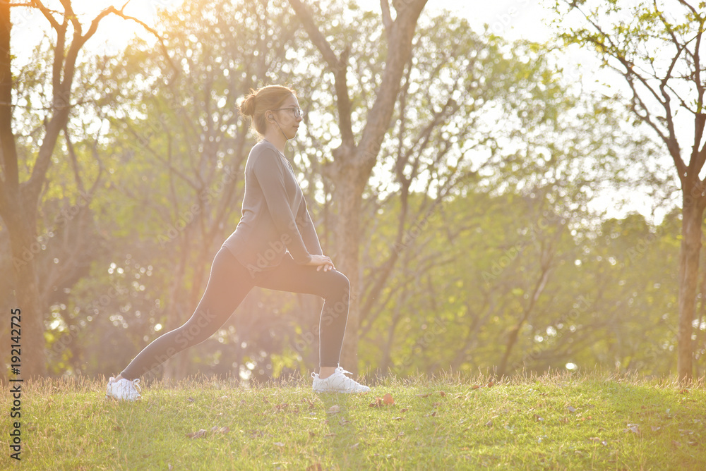 Happy Asian female workout at the park. Happy Asian female workout at the park.