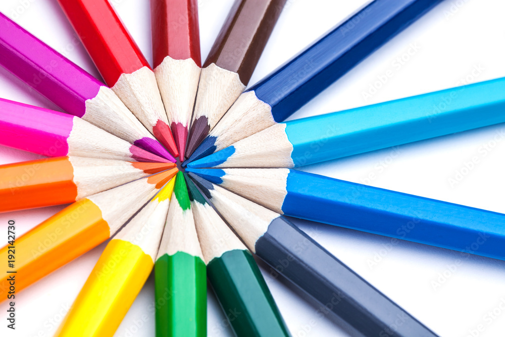 a circle of sharpened colored pencils on a white background. a circle of sharpened colored pencils on a white background.