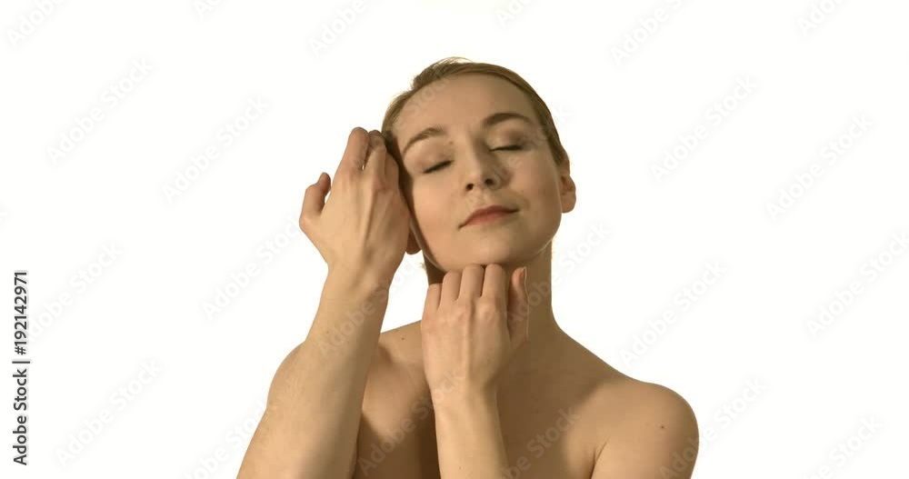 Beautiful healthy woman touching smooth skin on face in slow motion for beauty skincare concept. Beautiful healthy woman touching smooth skin on face in slow motion for beauty skincare concept.