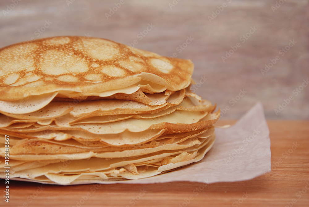 Stack of Tinny Pancakes on Kitchen Table with copy Space. Pancake's Day. Breakfast or Food Dessert. Stack of Tinny Pancakes on Kitchen Table with copy Space. Pancake's Day. Breakfast or Food Dessert.
