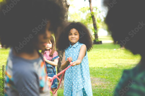Kids playing tug of war at the park