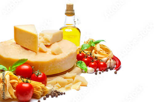 Traditional Italian parmesan or parmigiano cheese, pasta, tomatoes and olive oil photo