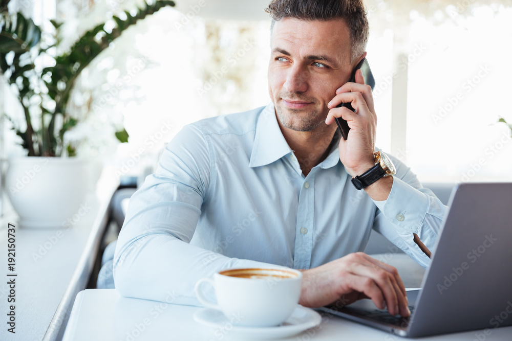 Portrait of a handsome mature man talking on mobile phone Portrait of a handsome mature man talking on mobile phone