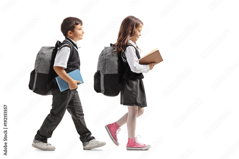 Ταπετσαρία Full length profile shot a schoolboy and a schoolgirl with backpacks and books w