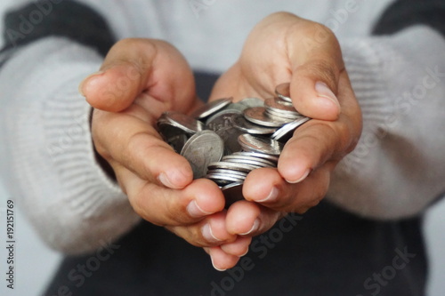 Man collect coins in hand