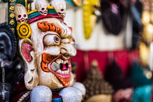 Traditional red Bhairav hindu mask hanging at souvenir market