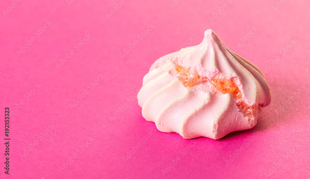 dessert meringue on pink close-up dessert meringue on pink close-up