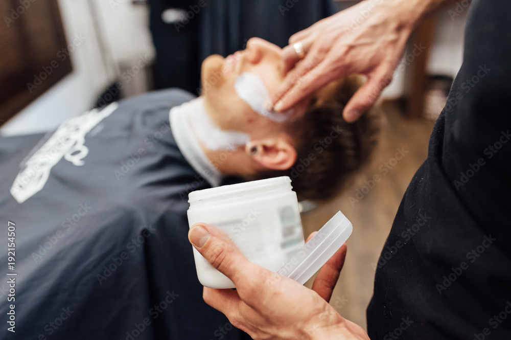 Barber shave and modeling beard at the hair salon Barber shave and modeling beard at the hair salon