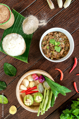 Oxtail soup in white dish on brown wood, Delicious Esan Thai food, Isan food