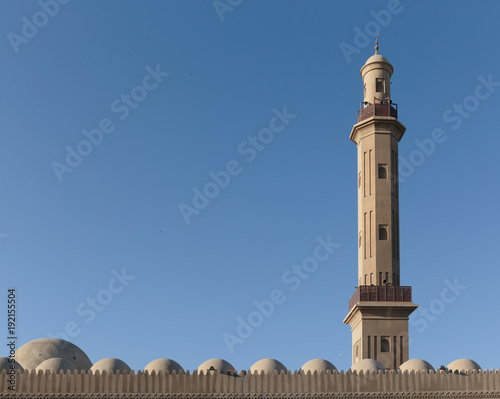 minaret on a sky background photo
