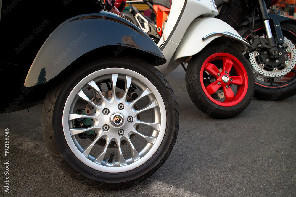 New motorcycles standing in the row closeup on wheels New motorcycles standing in the row closeup on wheels