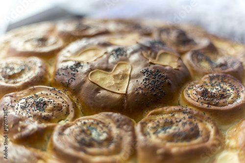 delicious and well-baked bread with sesame, eggs and milk. a heart-shaped loaf made for your loved one.