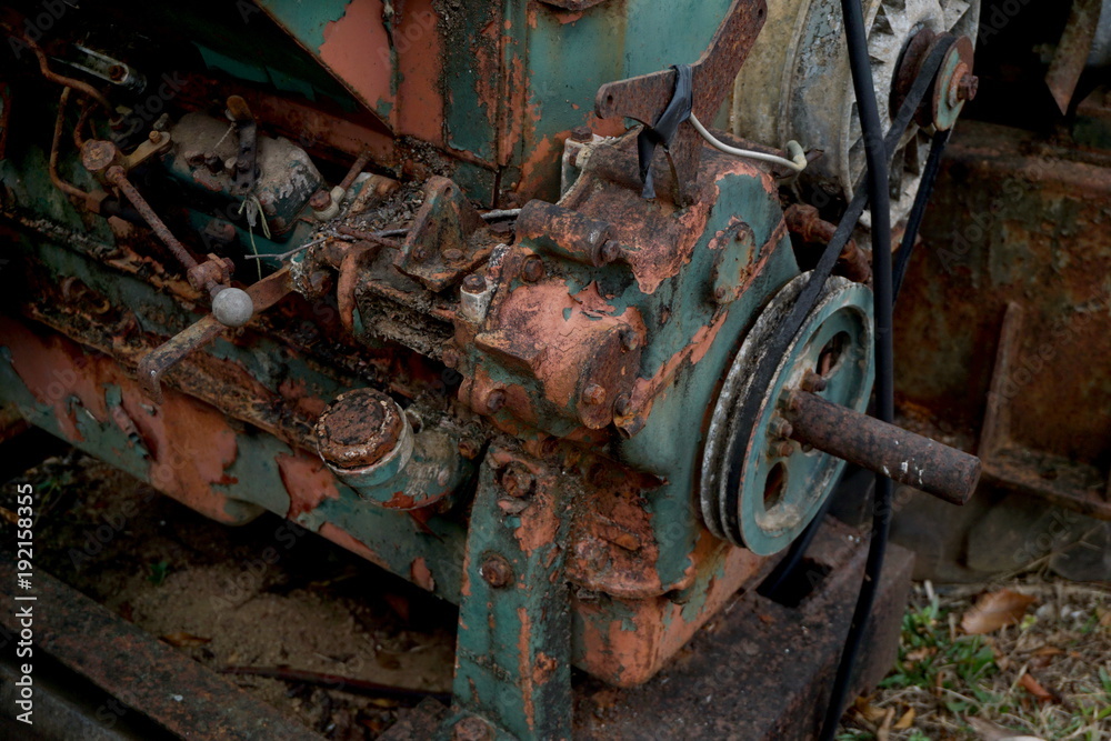 Grain Image: Close up of old machine factory made of steel and used in the past. Broken and rustic machine left over in abandon factory. Image of aged equipment with rust and gear part. Grain Image: Close up of old machine factory made of steel and used in the past. Broken and rustic machine left over in abandon factory. Image of aged equipment with rust and gear part.
