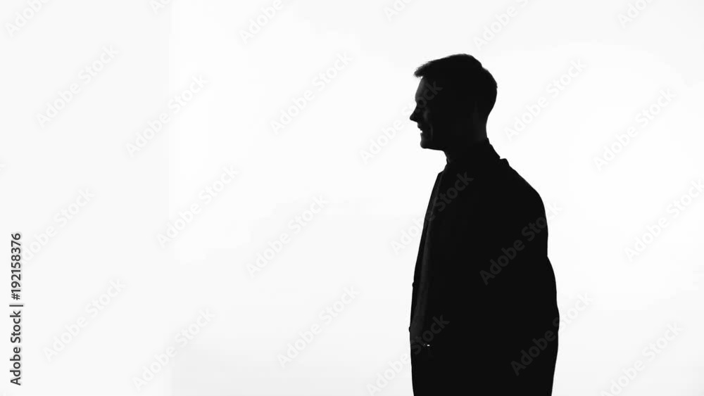 Man silhouette raising fists up, celebrating victory, good bargain, side view Man silhouette raising fists up, celebrating victory, good bargain, side view