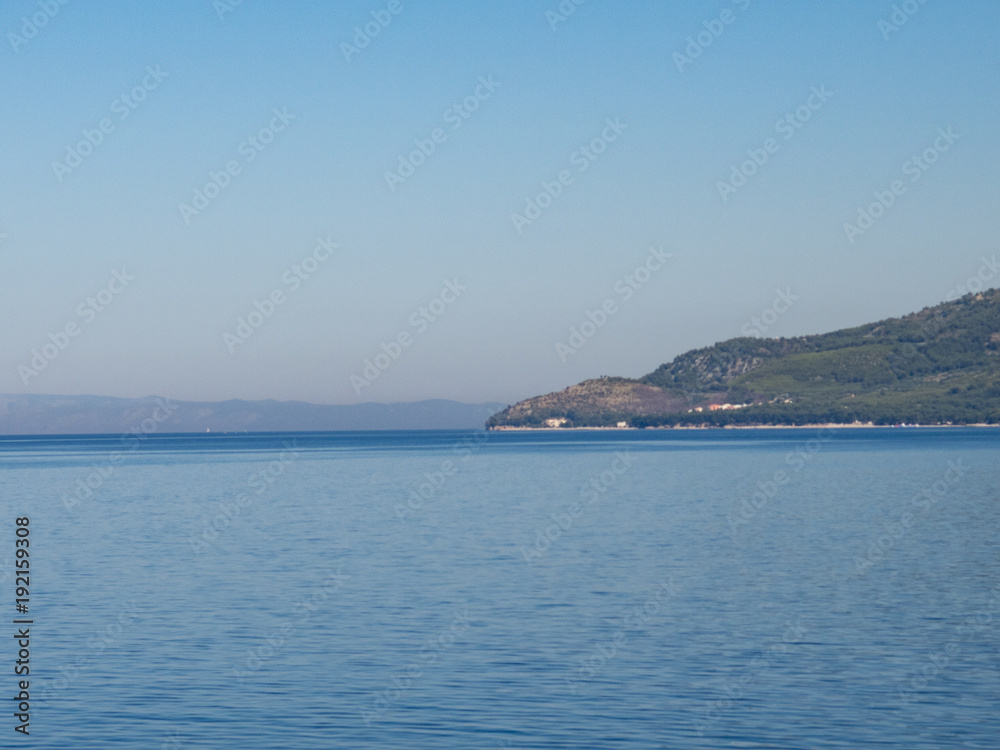 Beautiful landscape of Makarska riviera with high mountains Beautiful landscape of Makarska riviera with high mountains