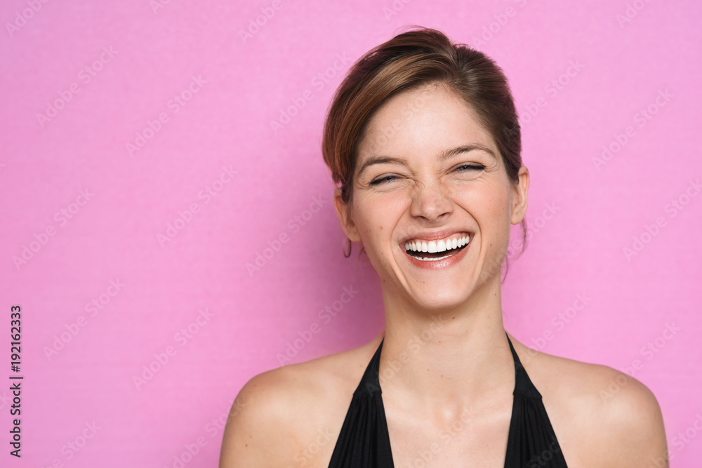 Charming laughing model on pink - obrazy, fototapety, plakaty 