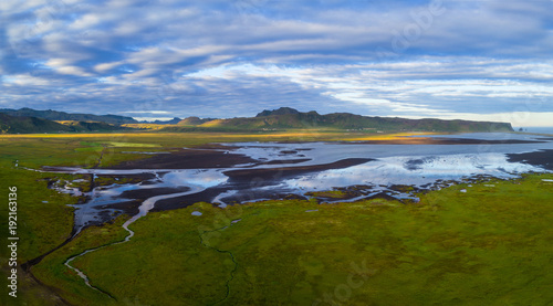 Coastline near Vik rocks  in Iceland , sunset time photo