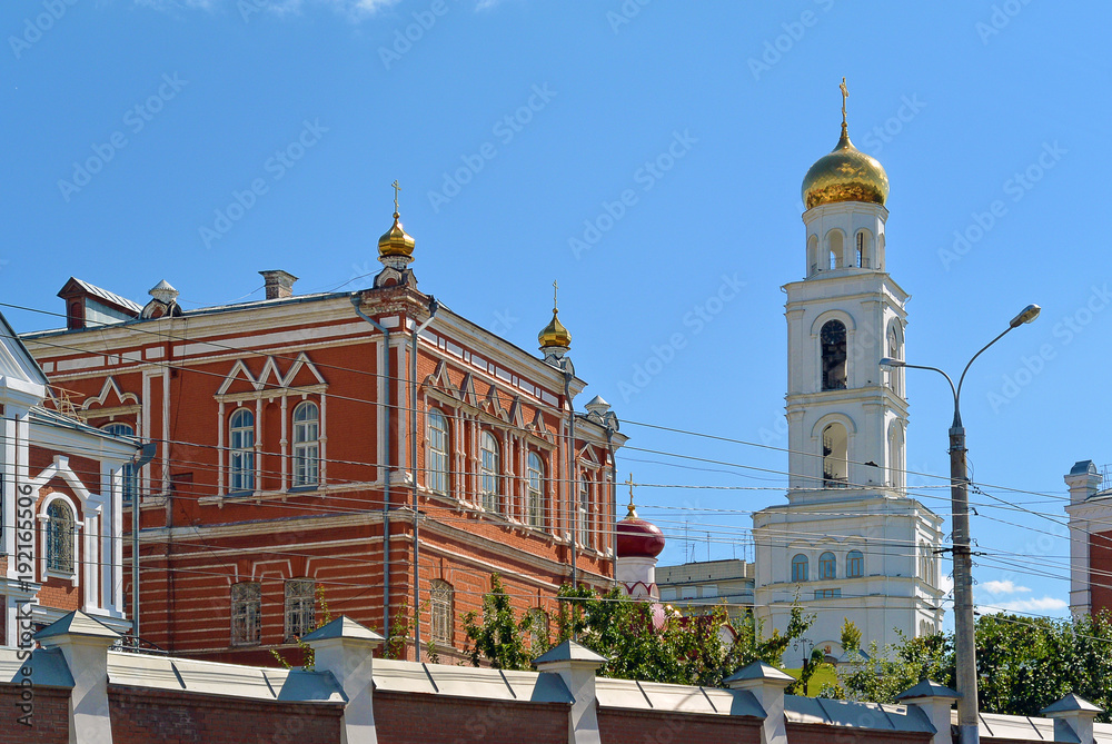 Travel showplace - Iversky Women's Monastery in Samara in sunny summer day, blue sky. Classic russian ortodox religion architecture