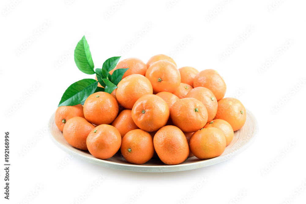 Heap of mandarin in bamboo plate isolated on white background. Food photography Heap of mandarin in bamboo plate isolated on white background. Food photography