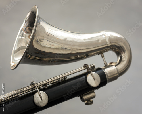 Sticker closeup of part of bass clarinet with gray background
