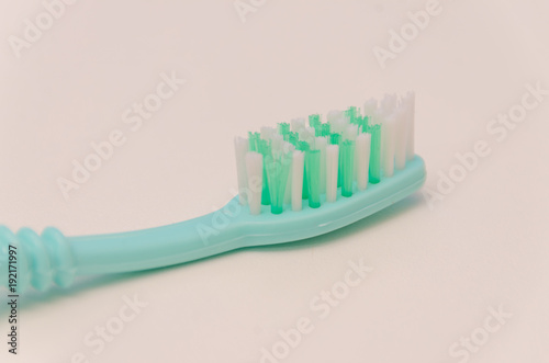  toothbrush on white table, close-up © dmitrypk