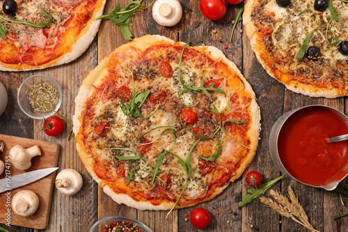 homemade pizza on wood background