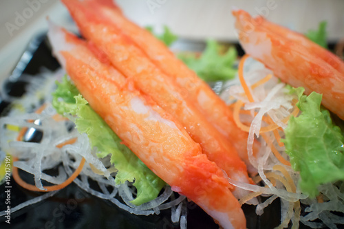 fresh crab stick with vegetables decorative on plate