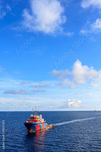 Offshore oil and gas supply boat approach to the platform for transfer passenger between supply boat and platform.