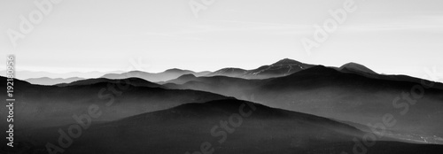 Mountain landscape in sutton, black and white with mist on background