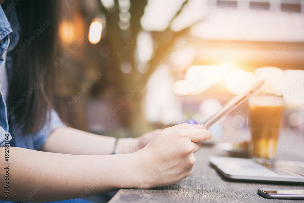 Obraz premium Young hipster woman enjoy her weekend with digital tablet for online social connection at home, technology lifestyle