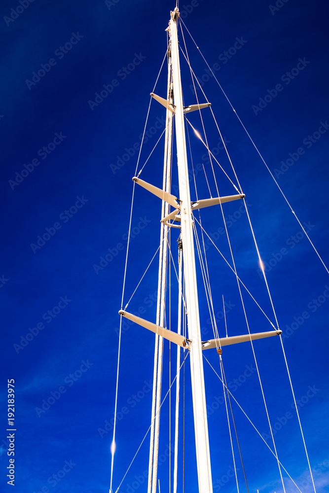 Detailed closeup of mast rigging top on sail boat Detailed closeup of mast rigging top on sail boat