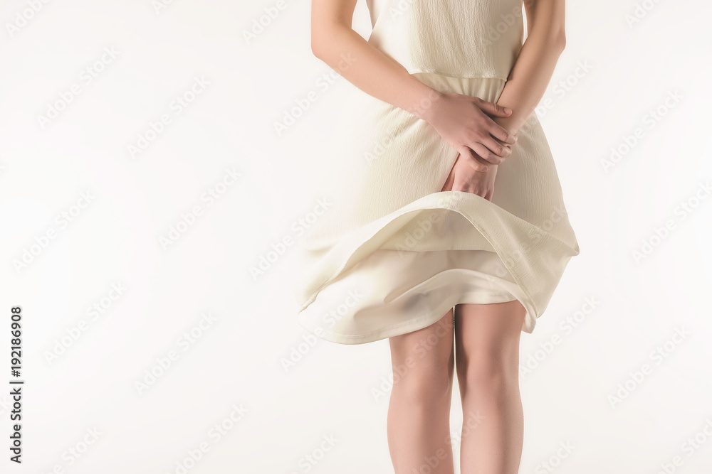 cropped view of elegant girl in waving white dress, isolated on white cropped view of elegant girl in waving white dress, isolated on white