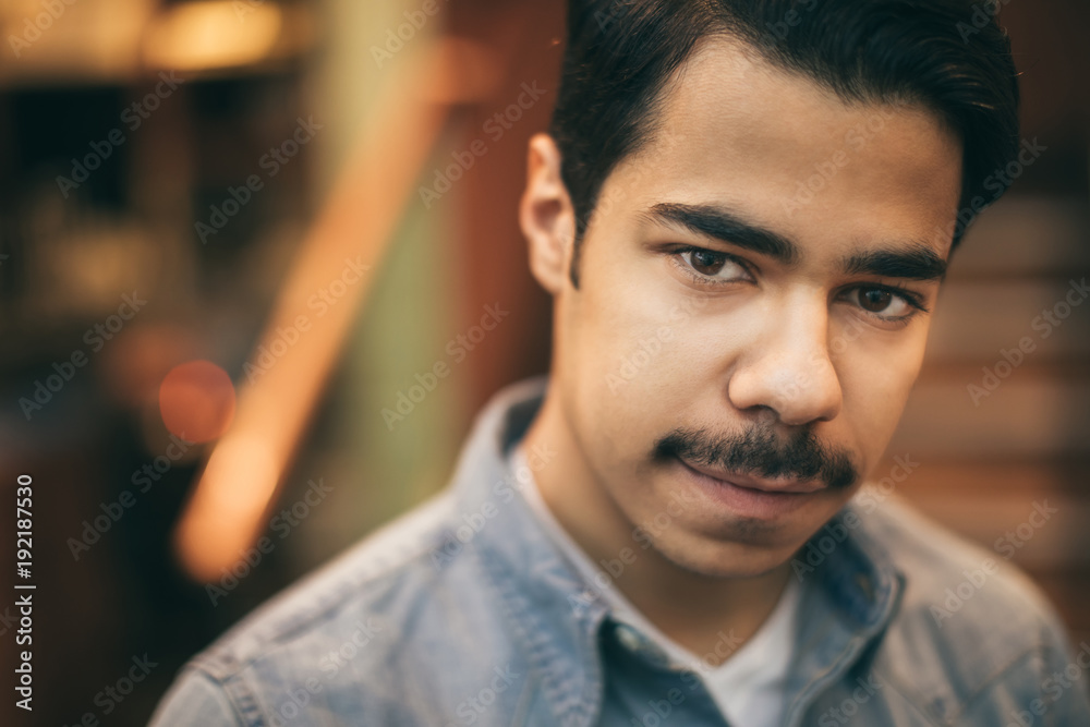 Portrait on young arabic mustache man looking to the camera Stock Photo |  Adobe Stock