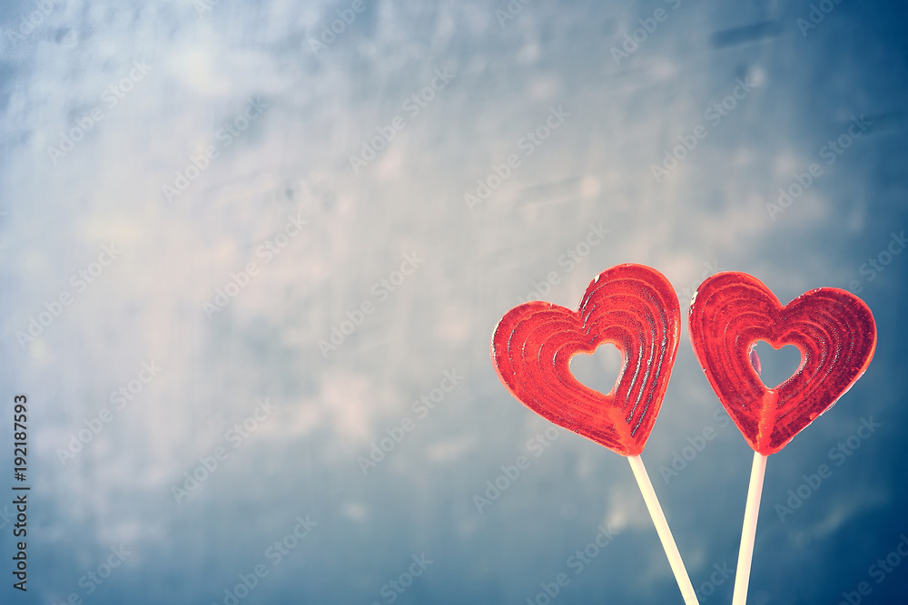 Two sweet valentines hearts on blue abstract background.