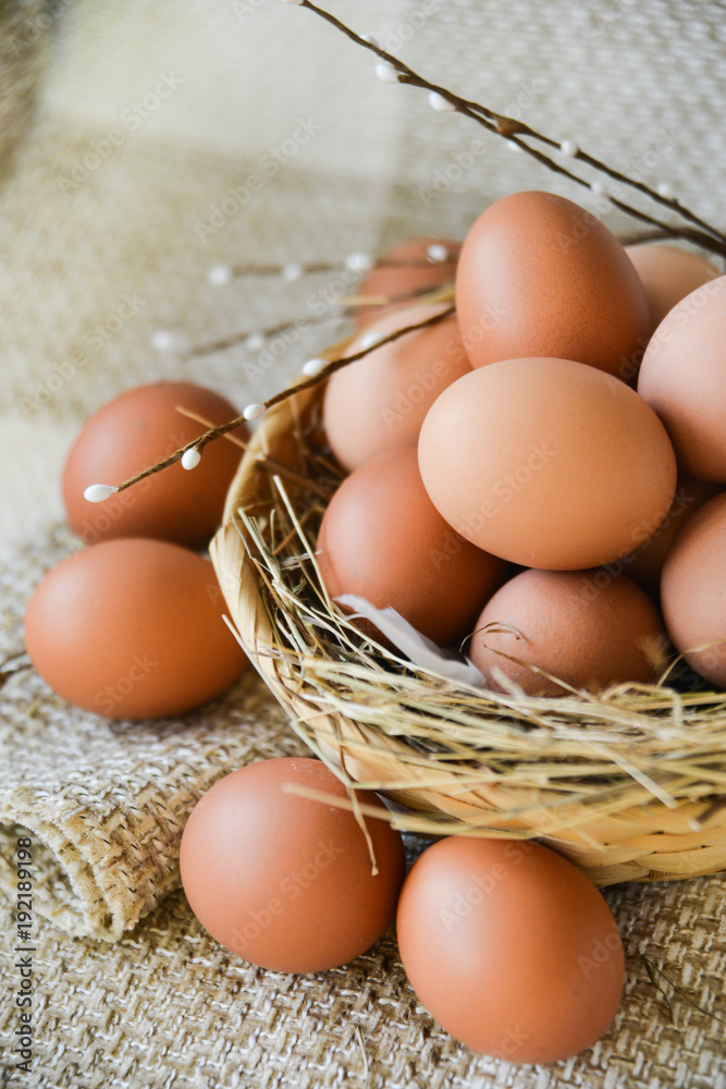fresh farm chicken egg in the basket on textile background, preparation for Easter fresh farm chicken egg in the basket on textile background, preparation for Easter