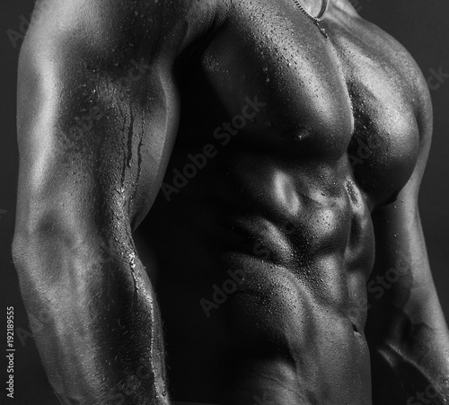 Sexy body part of male fitness model photo