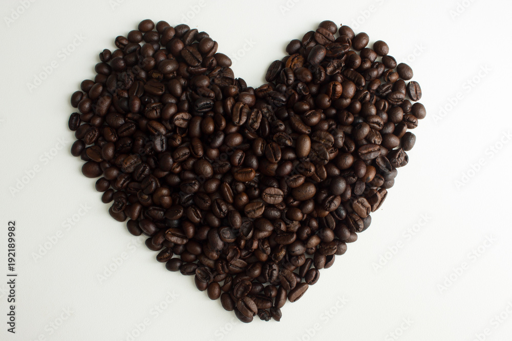 Roasted coffee beans in shape of heart Roasted coffee beans in shape of heart