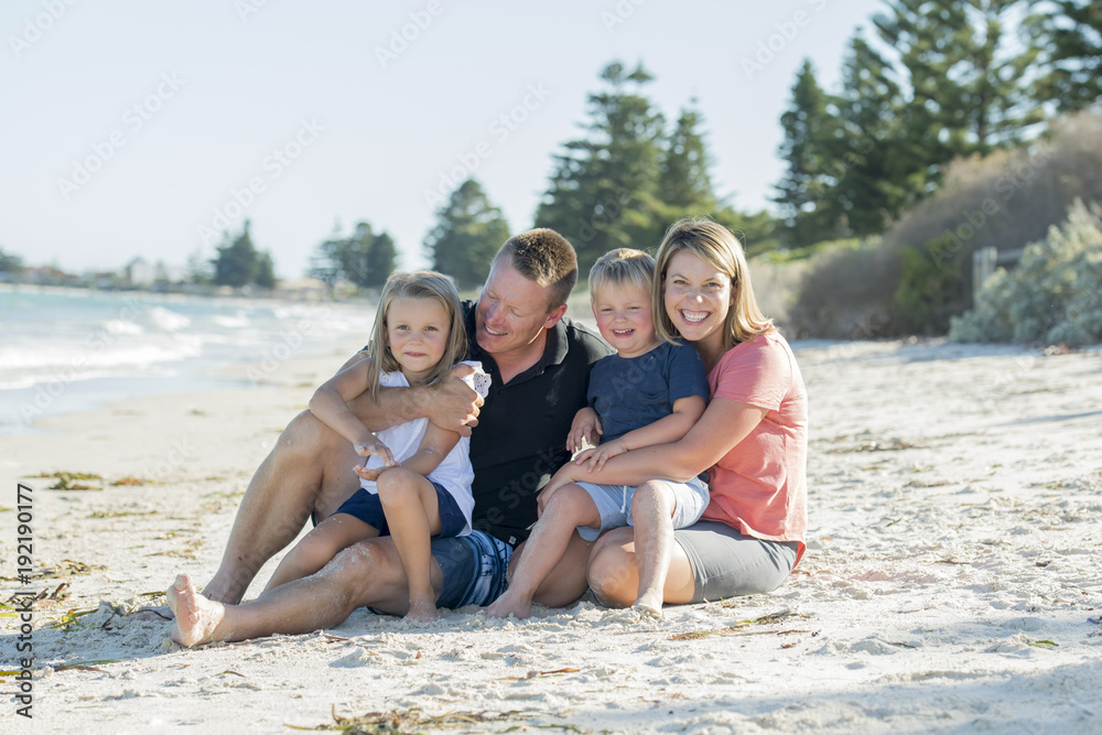 Εκτύπωση καμβά happy beautiful Caucasian family having holidays on the beach smiling with mothe