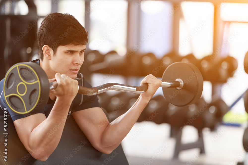 Φωτογραφία Asian man exercising in the gym, fitness, health, body good.