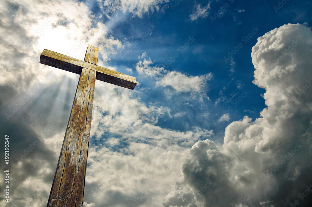 Cross against the sky. Happy Easter. Christian symbol Cross against the sky. Happy Easter. Christian symbol