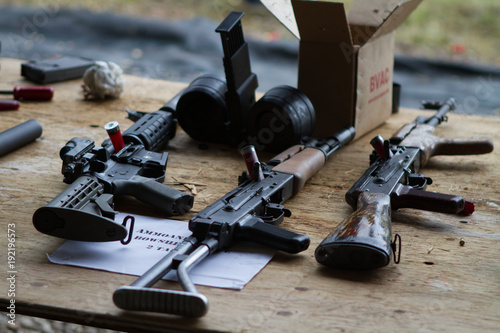 A table with assault rifles